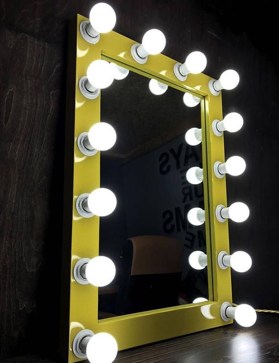 Glowing yellow vanity mirror