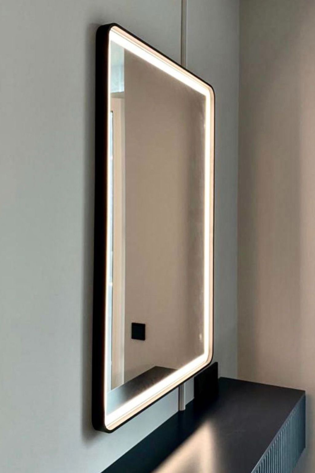 Framed lighted store mirror